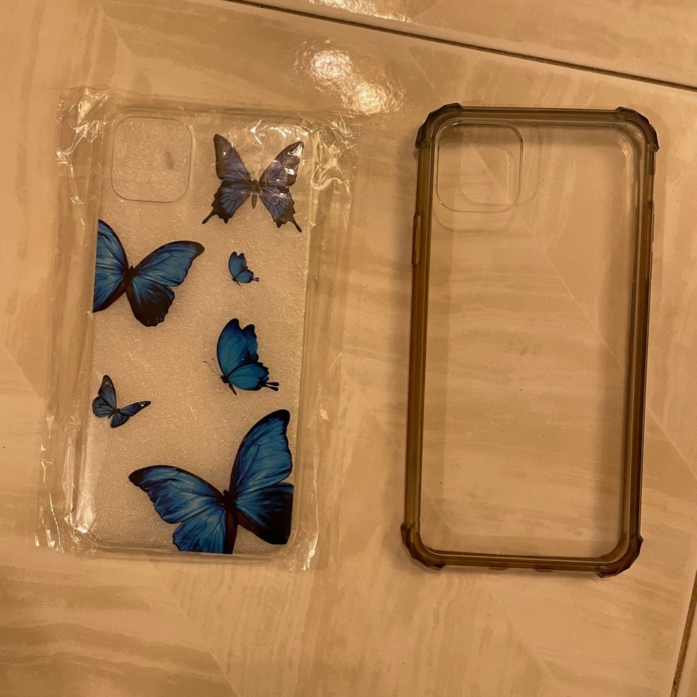 iPhone 11 ProMax phone new case with butterflies & an additional used clear case